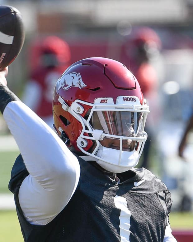 Razorbacks quarterback KJ Jefferson throwing during drills in Wednesday morning's practice